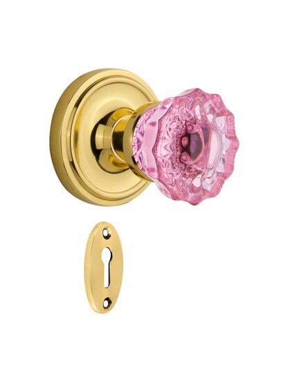 Classic Rosette Mortise Lock Set with Colored Fluted Crystal Glass Knobs Pink in Polished Brass.